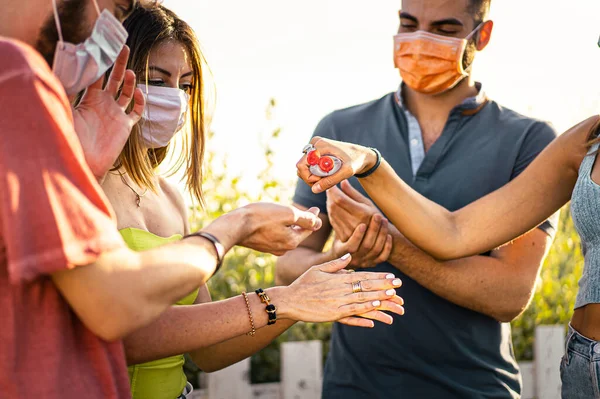 Group Young People Sanitizing Together Hands Bot — Stock Photo, Image