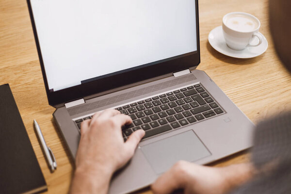 Man working remotely on laptop. Businessman working from home during pandemic