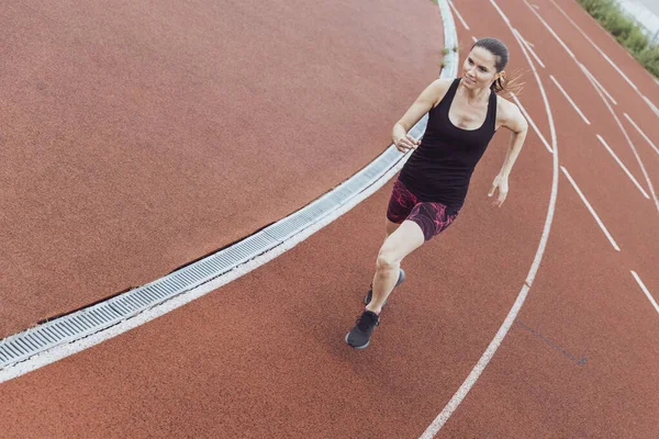 Woman running on a treadmill. Running track