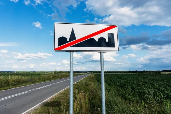 End of built up area road sign background. Speed limit road sign. — Stock Image End Built Area Road Sign Background Speed Limit Road Sign Royalty Free Stock Images