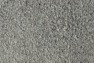 Gri sıva duvar arka planı. Evin dış tasarım dokusu. Dekoratif mimari desen.