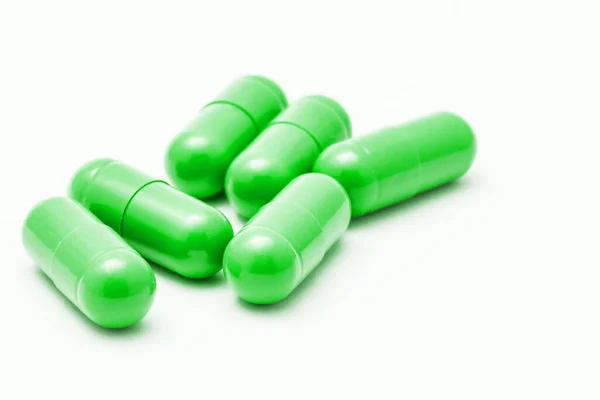 Pílulas Verdes Isoladas Fundo Branco — Fotografia de Stock