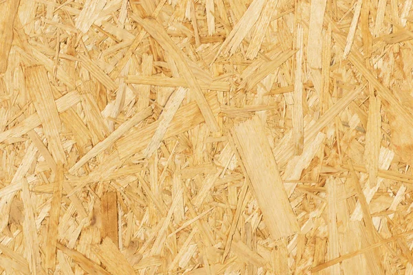 OSB yönetim kurulu dokusu. Kahverengi ahşap arka plan. Basit ütülü yonga deseni. Çip tahtası geçmişi. Kahverengi ahşap doku.