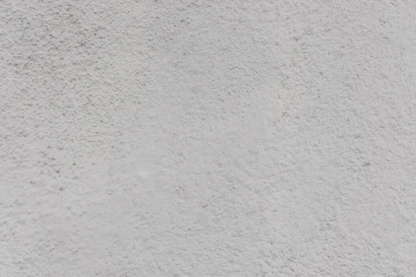 Stucco wall texture. White concrete surface background. Gray plaster wall pattern. Distressed noise backdrop for graphic design. Rough grain cement texture. Noise and grain overlay.