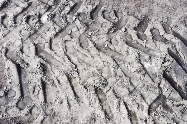 car wheel mark on sand, textured background