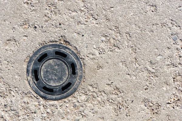 old rusty metal tire on the road