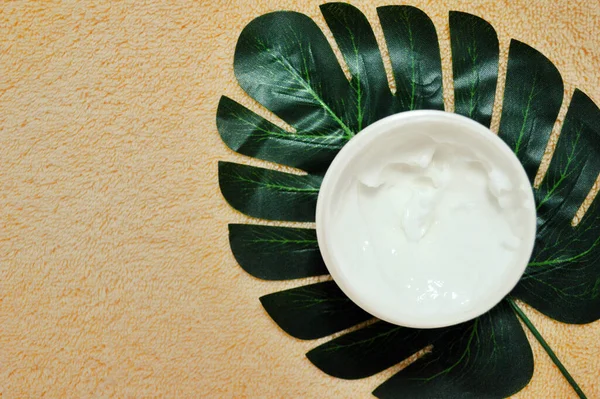 White Jar Cream Stands Palm Leaf Background Beige Fabric — Stock Photo, Image