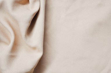 Arka plan olarak açık pembe tekstil deseni. Açık pembe kumaşın kumaş dokusunu kapatın. Buruşmuş kumaş dokusu