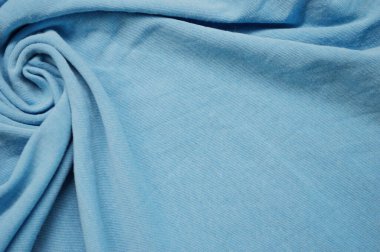 Arka plan olarak mavi tekstil deseni. Kumaştaki mavi kumaş dokusuna yaklaş. Buruşmuş kumaş dokusu