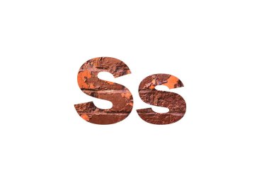 Kahverengi desenli tuğla duvar. S harfinin siluetini delip geçmiş.