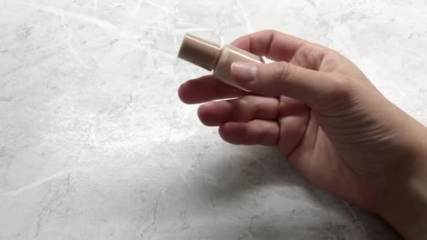 Woman Twirls Beige Nail Polish Her Hands — Vídeo de Stock