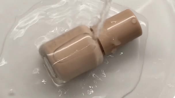 Water Pours Top Glass Jar Beige Nail Polish — 图库视频影像