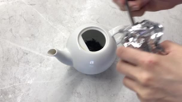 Woman Pouring Green Leaf Tea Teapot Metal Spoon Light Wooden — Wideo stockowe