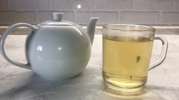 Woman Throwing Two Sugar Cubes Green Tea Glass Transparent Cup — Αρχείο Βίντεο