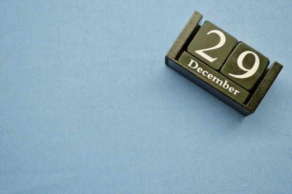 Holzkalender Aus Blöcken Auf Blauem Textilgrund Mit Kopierraum Dezember Internationaler — Stockfoto