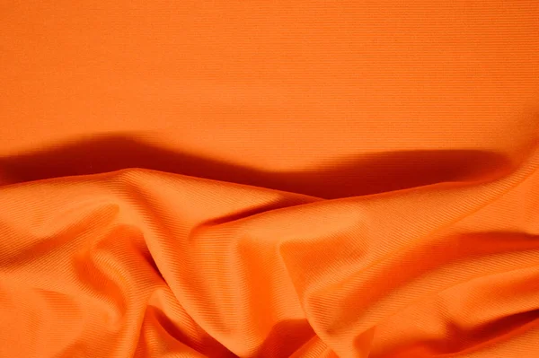 Orange textile pattern as a background. Orange material texture on fabric — Stock Photo, Image