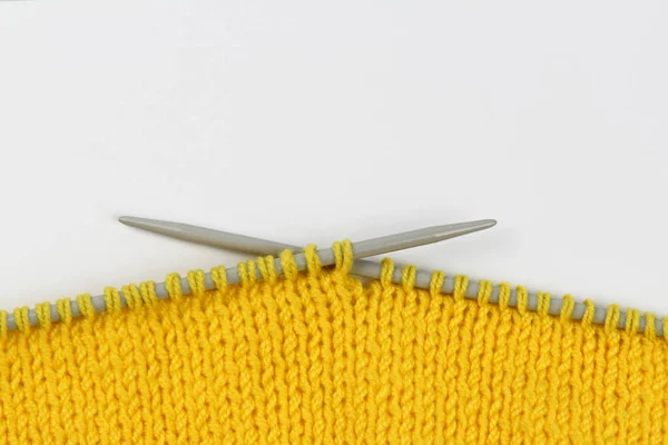 Knitted Fabric Made Yellow Woolen Threads Gray Knitting Needles White — Stock Photo, Image