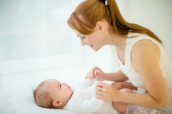 Mother and Baby kissing and hugging. Happy Family