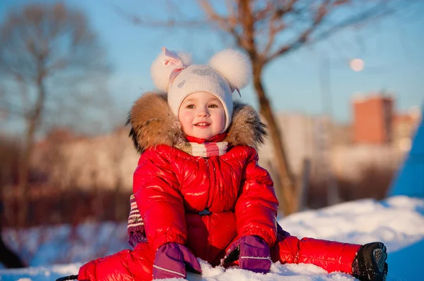 Winter, snowman - lovely girl has a fun in snow — Stock Photo, Image