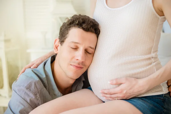 Husband hugs his pregnant wife belly — Stock Photo, Image