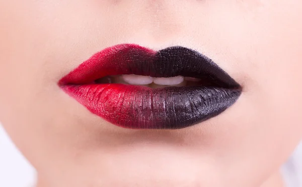 Beautiful red dark glossy lips close-up.