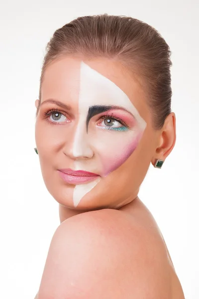 Portrait of a young girl with paint on her face — Stock Photo, Image