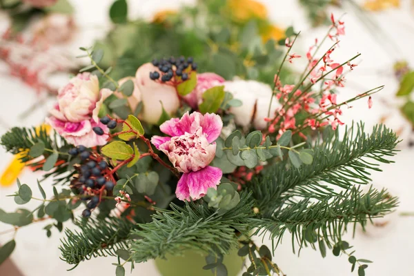 Creating a wonderful composition cotton, cones, fir, magical variety carnations and delicious varieties of roses. Handmade — Stock Photo, Image