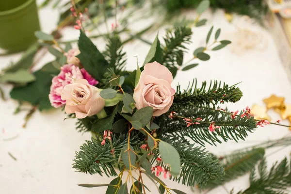 Creating a wonderful composition cotton, cones, fir, magical variety carnations and delicious varieties of roses. Handmade — Stock Photo, Image