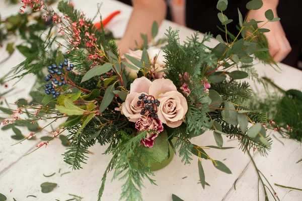 Creating a wonderful composition cotton, cones, fir, magical variety carnations and delicious varieties of roses. Handmade — Stock Photo, Image