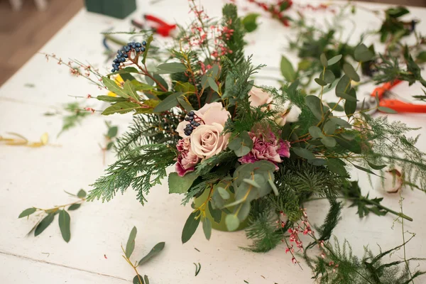 Creating a wonderful composition cotton, cones, fir, magical variety carnations and delicious varieties of roses. Handmade — Stock Photo, Image