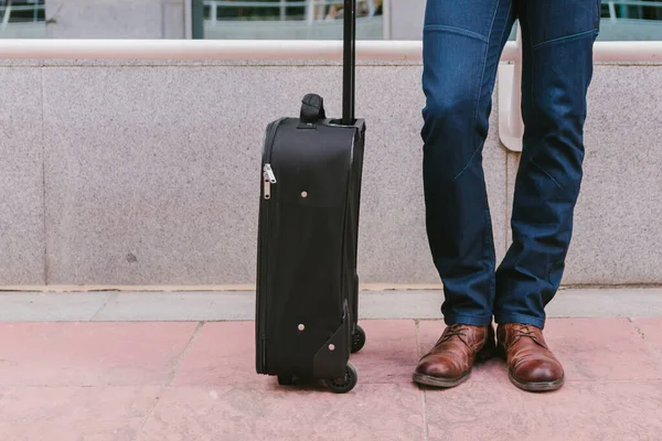 Man carries luggage in the lobby before the trip. Travel and vacation concept. lifestyle.