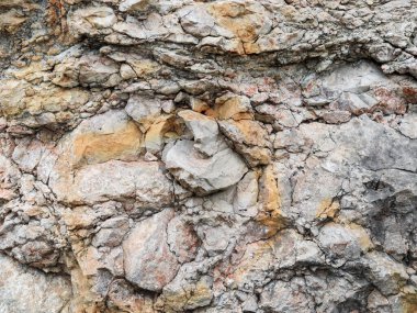 Gri-sarı kayalık dağların soyut dokusu, yakın çekim..