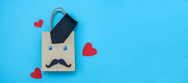 Craft Bag Tie Paper Mustache Hearts Left Blue Background Space — Stock Photo, Image