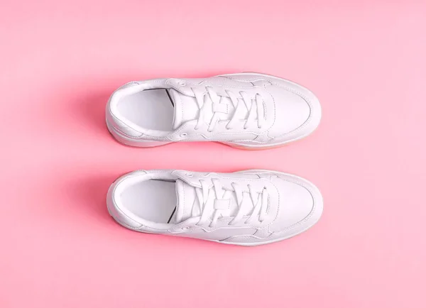 White Womens Gumshoes Pink Background Close Top View — 스톡 사진