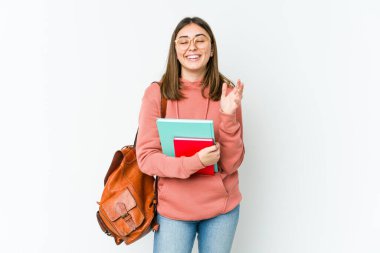 Genç bayan öğrenci fırında yapayalnız ve neşeli bir şekilde gülüyor. Mutluluk kavramı.