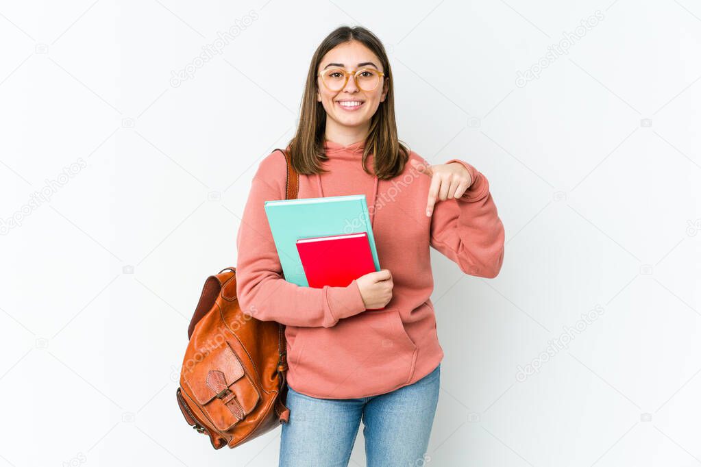 Young student woman isolated on white bakcground points down with fingers, positive feeling.