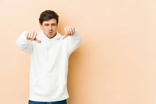 Young Cool Man Showing Thumb Expressing Dislike — Stock Photo, Image