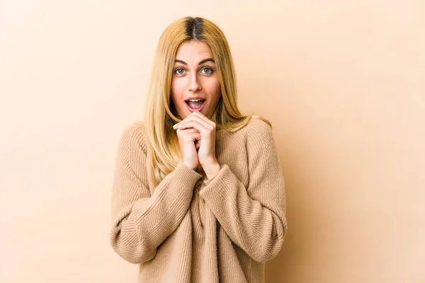 Young Blonde Caucasian Woman Praying Luck Amazed Opening Mouth Looking — Stock Photo, Image