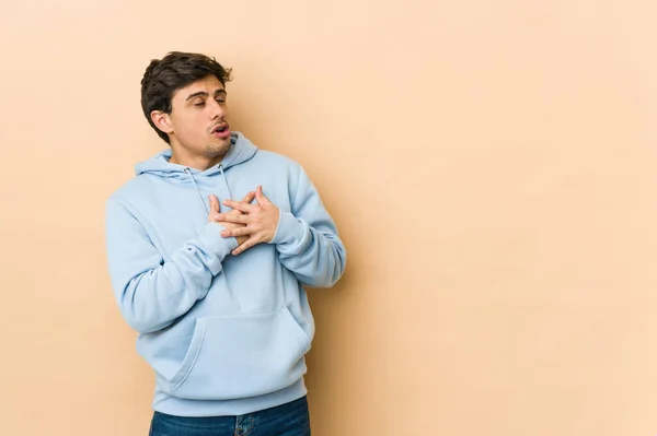 Young Cool Man Has Friendly Expression Pressing Palm Chest Love — Stock Photo, Image