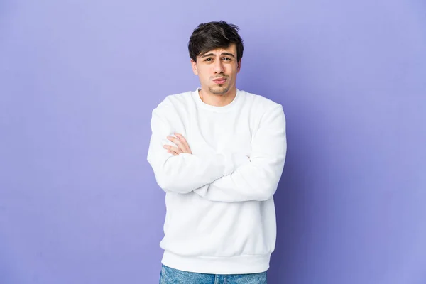 Stock image Young cool man blows cheeks, has tired expression. Facial expression concept.