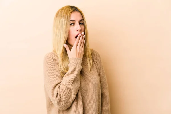 Young Blonde Caucasian Woman Yawning Showing Tired Gesture Covering Mouth — Stock Photo, Image