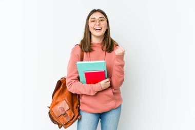 Beyaz fırında yalnız kalmış genç bir bayan tasasız ve heyecanlı bir şekilde tezahürat yapıyor. Zafer konsepti.