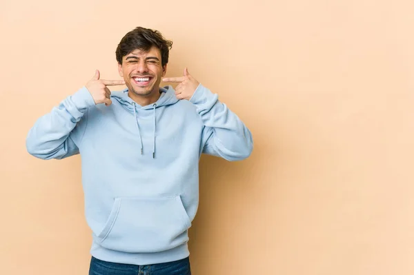 Young Cool Man Smiles Pointing Fingers Mouth — Stock Photo, Image