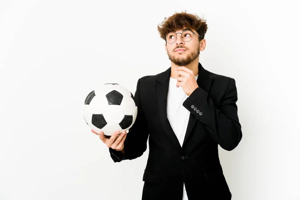 Young Indian Soccer Coach Isolated Looking Sideways Doubtful Skeptical Expression — Foto Stock