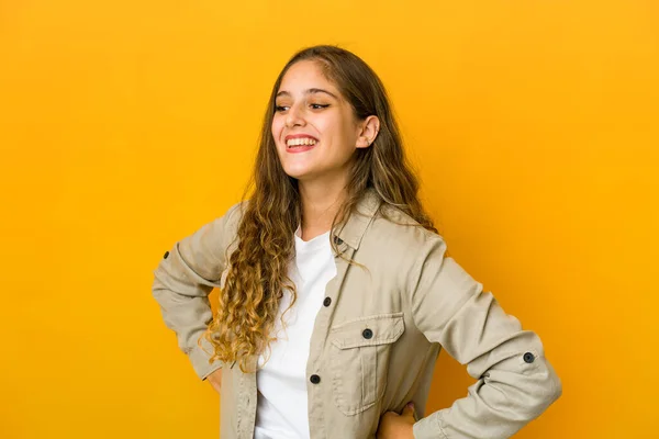 Young Caucasian Woman Laughs Happily Has Fun Keeping Hands Stomach — Stock Photo, Image