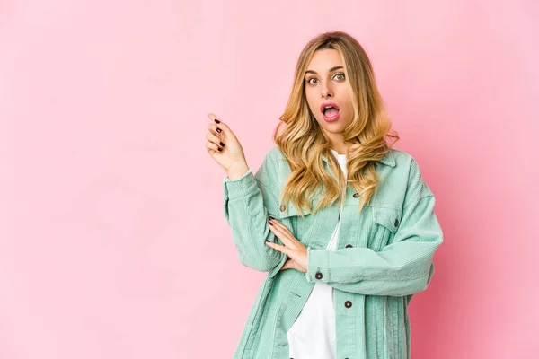 Young Caucasian Blonde Woman Pointing Side — Stock Photo, Image