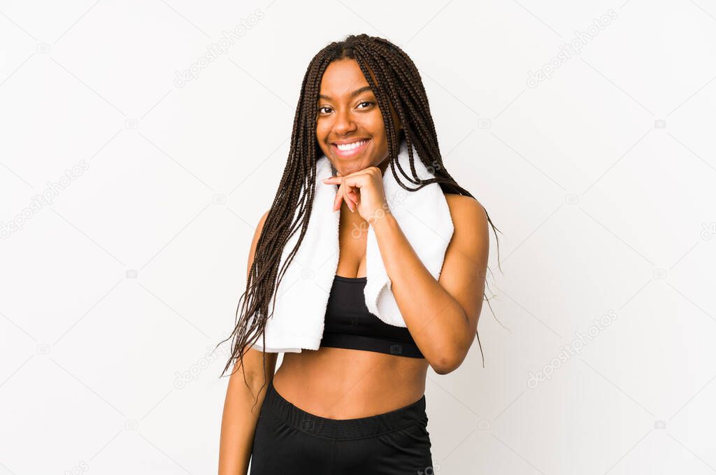Young african american sport woman isolated smiling happy and confident, touching chin with hand.