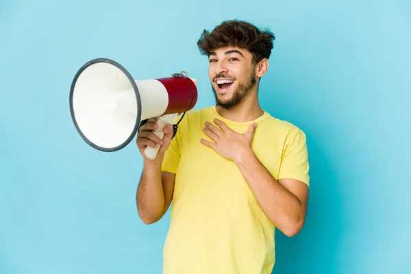 Young Arab Man Holding Megaphone Laughs Out Loudly Keeping Hand — Foto Stock