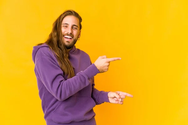 Young Man Long Hair Look Pointing Forefingers Copy Space Expressing — Stock Photo, Image