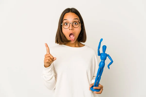 Young Hispanic Mixed Race Woman Holding Wood Doll Having Idea — Stok fotoğraf